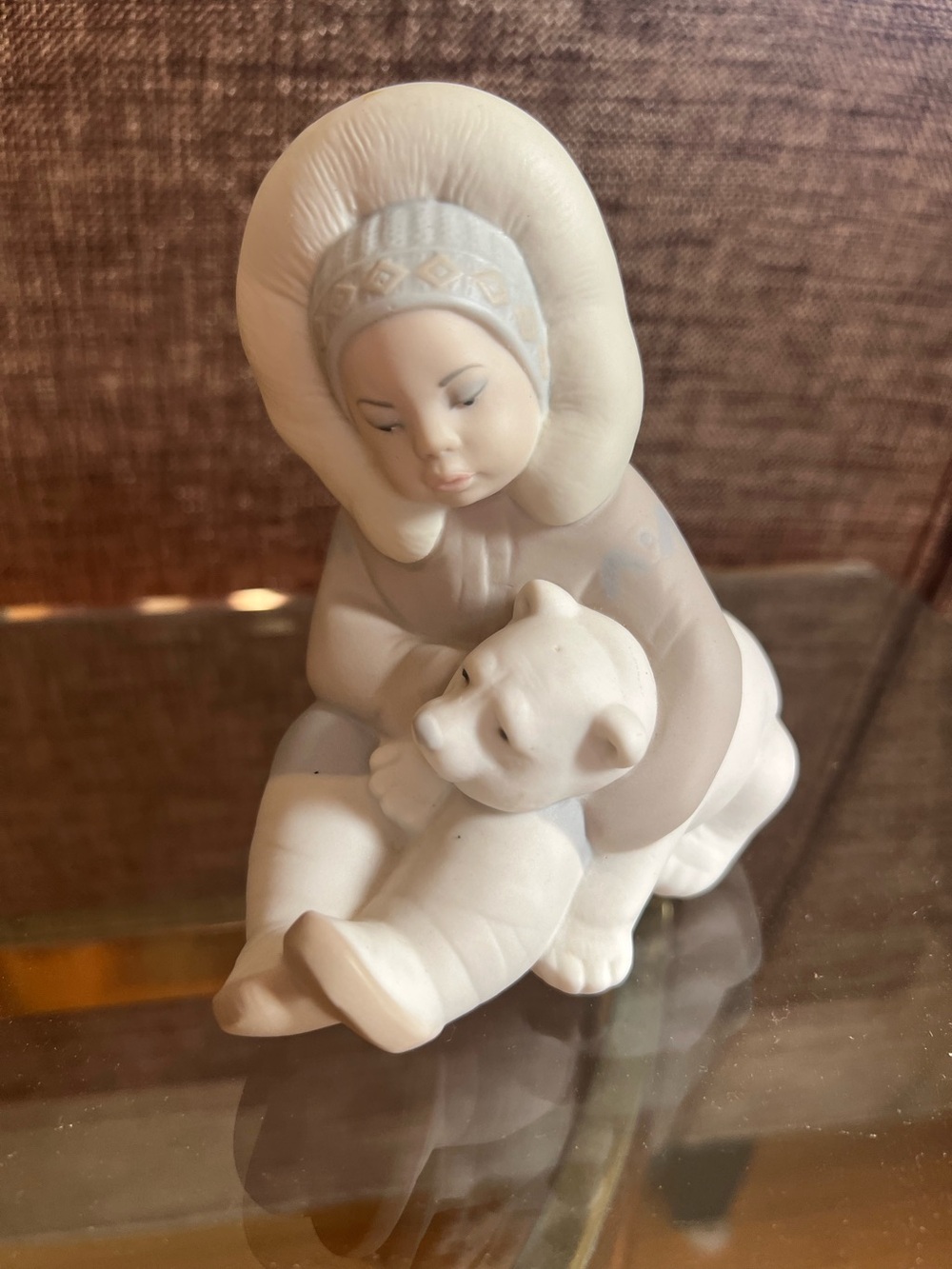 Retired Lladro “Eskimo Playing” matte bisque figurine